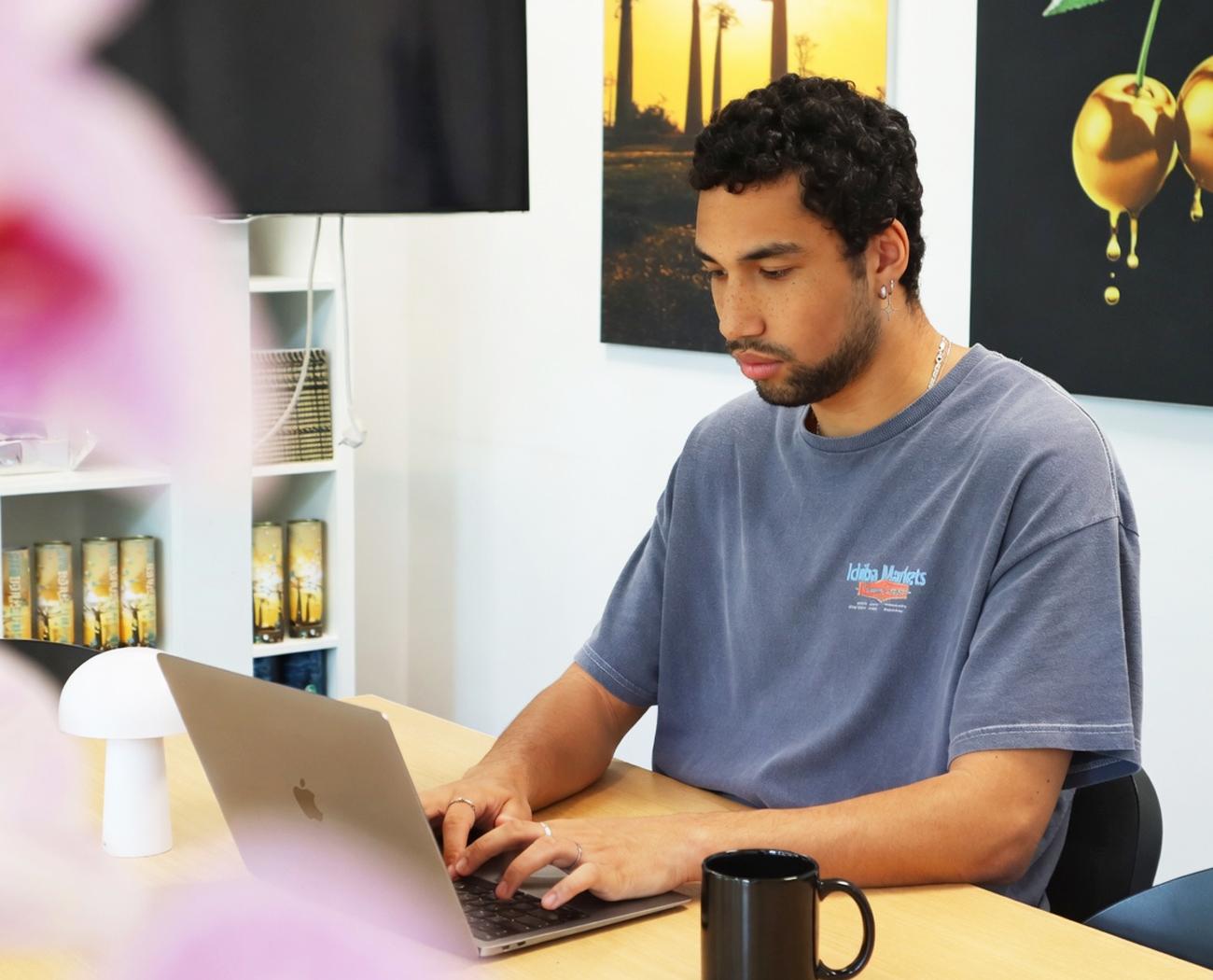 A CMS for your website | Man working at a laptop