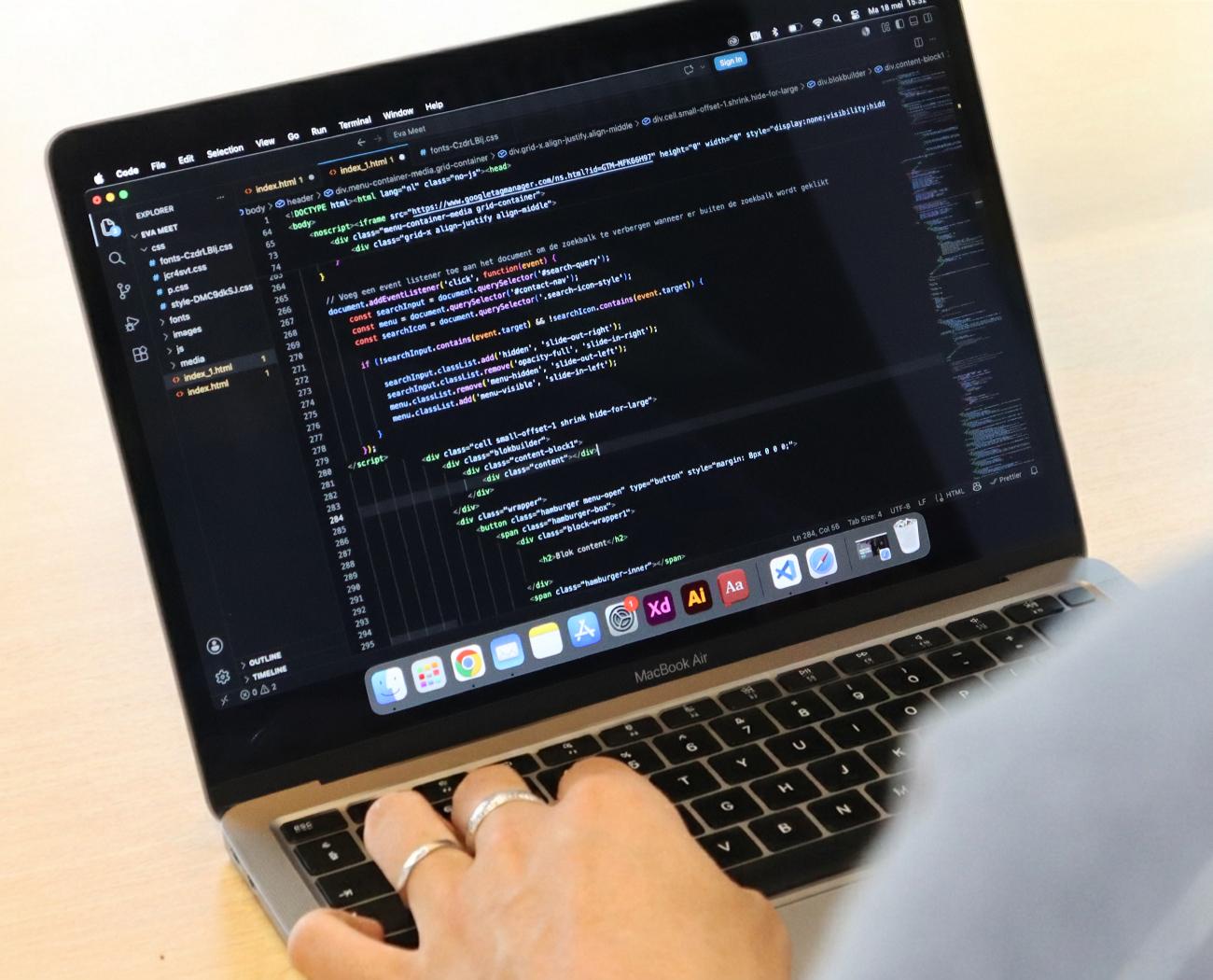 Mobile first web design | A developer is writing code