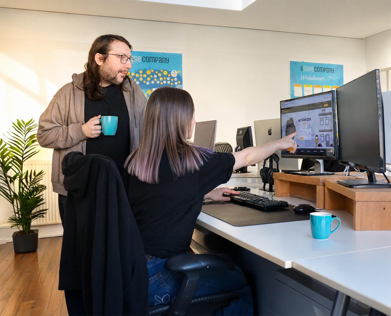 Website maintenance | two people looking at something on a computer